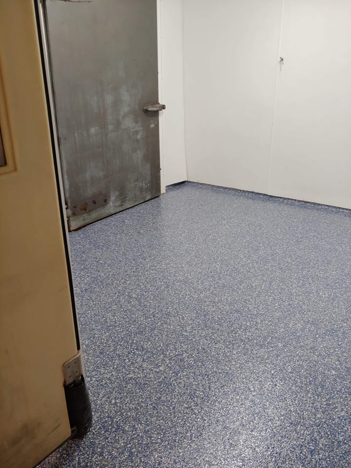 Our client selected a custom Vinyl Chip color for this Restaurant & Commercial Kitchen. These floors now reflect a beautiful blue, white and black ambiance that shines all throughout their facility! They are also tough and will hold up against stains, grease, abrasions and a multitude of other abuses - all of which Commercial kitchens are bound to sustain.